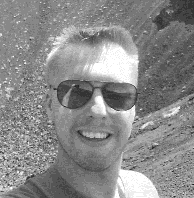 Photo of Marcin Sawicki smiling in sunglasses